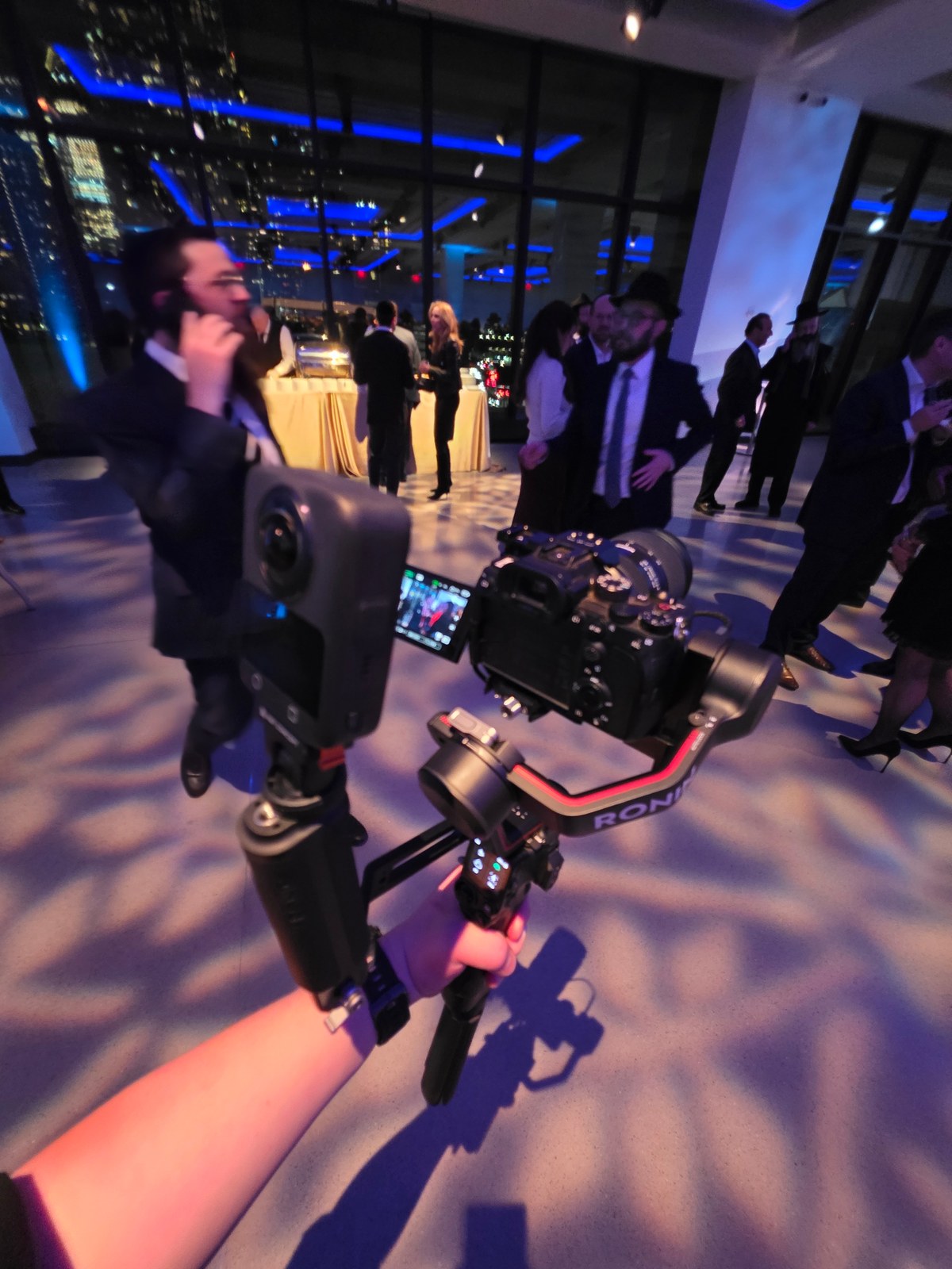 A camera on a gimbal capturing a live event
