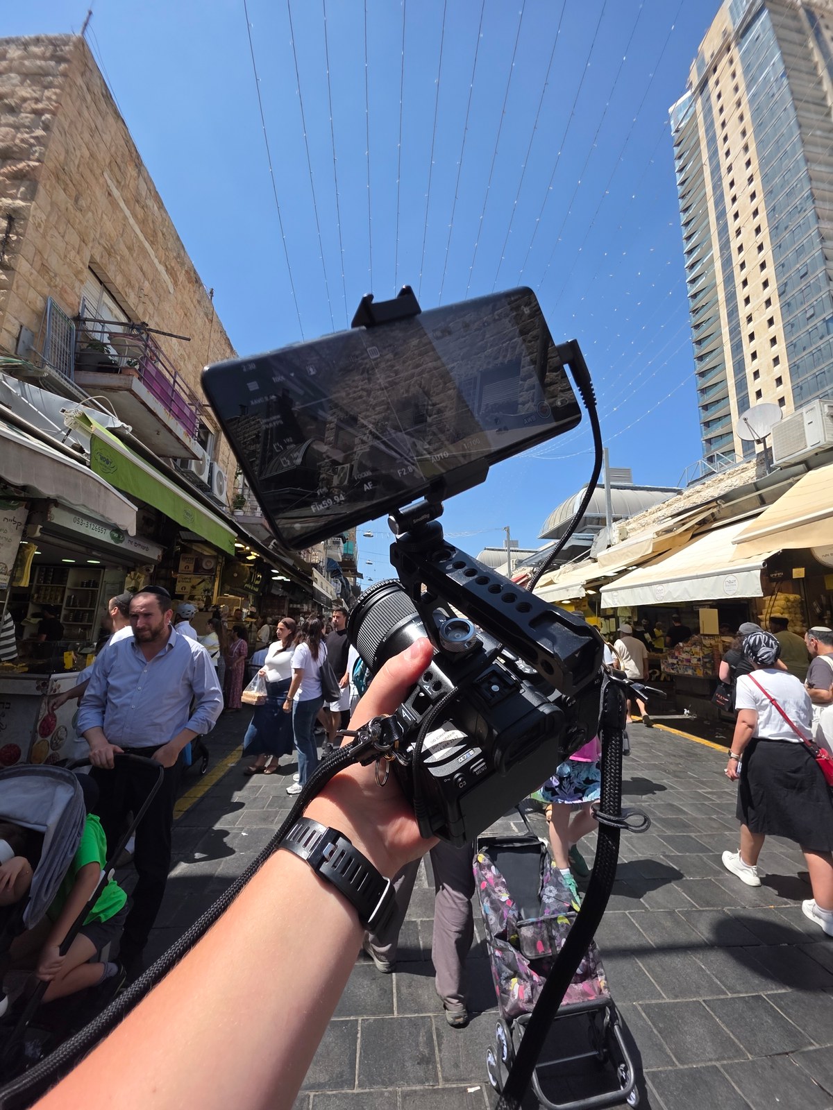 Filming in an outdoor market with a handheld camera rig