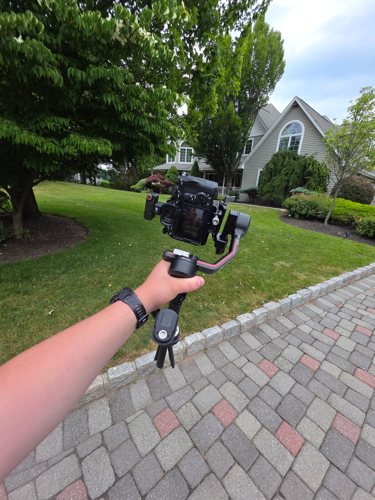 Filming a home exterior with a camera on a gimbal